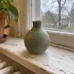 The vase before, on a windowsill