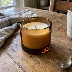The candle before, on a kitchen table