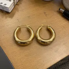 The earrings before, on a desk